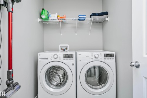 Located upstairs. - 7280 Edgemont Way, Edmonton, AB - Indoor Photo Showing Laundry Room