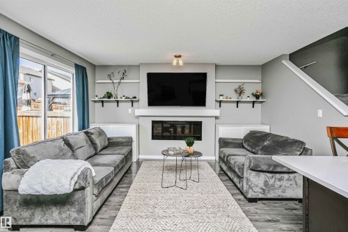 7280 Edgemont Way, Edmonton, AB - Indoor Photo Showing Living Room With Fireplace
