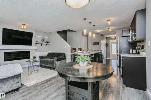 7280 Edgemont Way, Edmonton, AB - Indoor Photo Showing Living Room With Fireplace