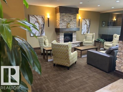 710 10303 111 Street, Edmonton, AB - Indoor Photo Showing Living Room With Fireplace