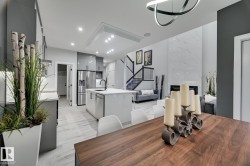 Contemporary open-concept living space featuring light wood-finish flooring - 
