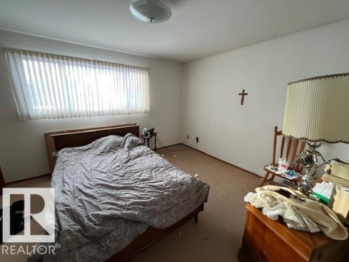 Bedroom featuring carpeted flooring, a wide window with blinds, and white walls - 11003 144 Street, Edmonton, AB - Indoor Photo Showing Bedroom