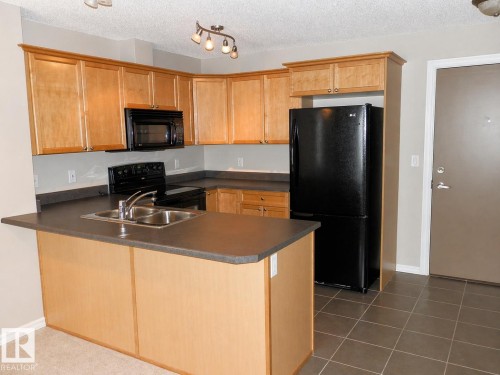 417 4403 23 Street, Edmonton, AB - Indoor Photo Showing Kitchen With Double Sink