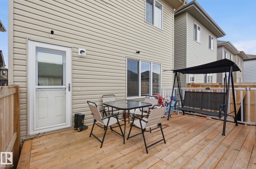 The property features a private wood deck, offering an outdoor living space - 4636 175 Ave, Edmonton, AB - Outdoor With Deck Patio Veranda With Exterior