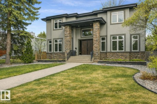 Contemporary exterior featuring a stone and stucco facade - 8927 120 Street, Edmonton, AB - Outdoor With Facade