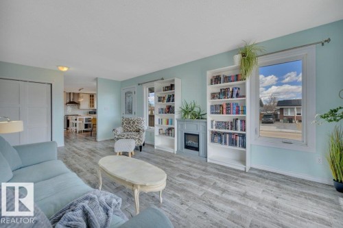 4002 42B Avenue, Leduc, AB - Indoor Photo Showing Living Room With Fireplace