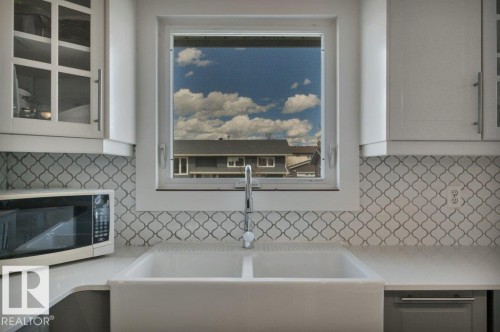 4002 42B Avenue, Leduc, AB - Indoor Photo Showing Kitchen With Double Sink