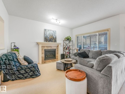3031 Spence Wynd, Edmonton, AB - Indoor Photo Showing Living Room With Fireplace