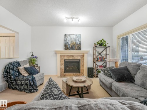 3031 Spence Wynd, Edmonton, AB - Indoor Photo Showing Living Room With Fireplace