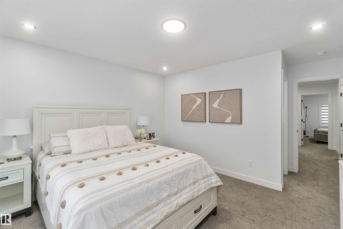 Carpeted room featuring recessed lighting and a central flush-mount light fixture - 124 28 Street, Edmonton, AB 