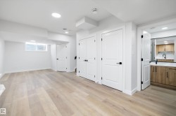 Bright lower-level room featuring light wood-finish flooring, recessed lighting, and a window - 