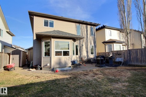 Two-story residence with beige siding exterior and contrasting dark roofing - 1212 Westerra Crescent, Stony Plain, AB - Outdoor