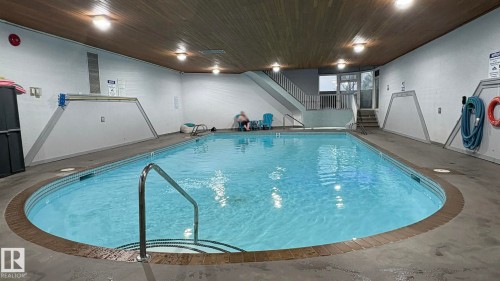 203 5125 Riverbend Road, Edmonton, AB - Indoor Photo Showing Other Room With In Ground Pool