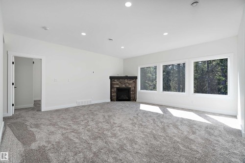 131 Bela Drive, Millet, AB - Indoor Photo Showing Other Room With Fireplace