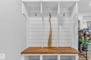 Built-in hall tree with a wooden bench top and storage cubbies - 7408 92 Avenue, Edmonton, AB  - Indoor Photo Showing Other Room 