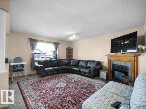 5320 156 Avenue, Edmonton, AB - Indoor Photo Showing Living Room With Fireplace