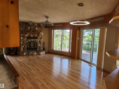 404, 59201 Range Road 95, Rural St. Paul County, AB - Indoor Photo Showing Living Room With Fireplace