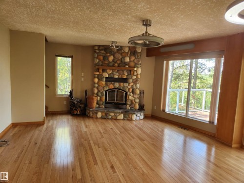 404, 59201 Range Road 95, Rural St. Paul County, AB - Indoor Photo Showing Living Room With Fireplace