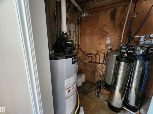 Mechanical room for Furnace  and water system - 404, 59201 Range Road 95, Rural St. Paul County, AB - Indoor Photo Showing Basement