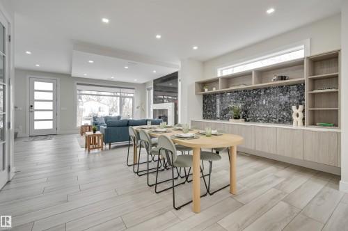 Open concept interior featuring light wood-finish flooring - 9741 90 Avenue, Edmonton, AB - Indoor Photo Showing Other Room