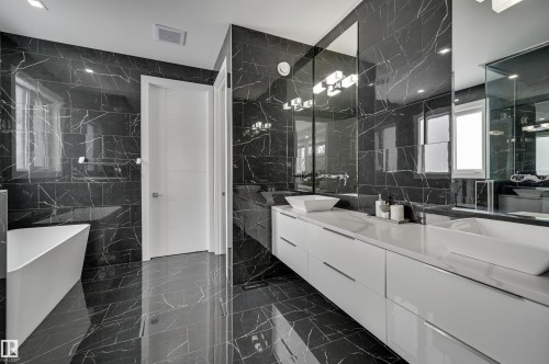Contemporary bathroom featuring dark marble-look tile flooring and walls - 9741 90 Avenue, Edmonton, AB - Indoor Photo Showing Bathroom