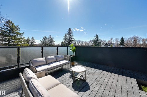 Expansive outdoor deck featuring composite wood-finish flooring - 9741 90 Avenue, Edmonton, AB - Outdoor With Deck Patio Veranda