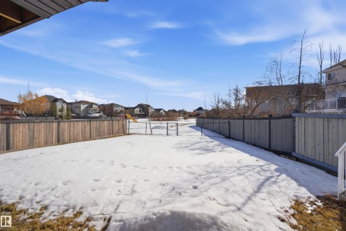The property features a fenced yard with a clear view of surrounding properties and open space - 6009 36 Avenue, Beaumont, AB - Outdoor