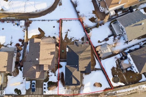 Expansive property with defined boundaries featuring a primary residence with an asphalt shingle roof - 6009 36 Avenue, Beaumont, AB - Outdoor With View