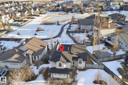 Aerial perspective highlighting a residential property with a multi-gabled roof and an attached garage - 6009 36 Avenue, Beaumont, AB - Outdoor With View