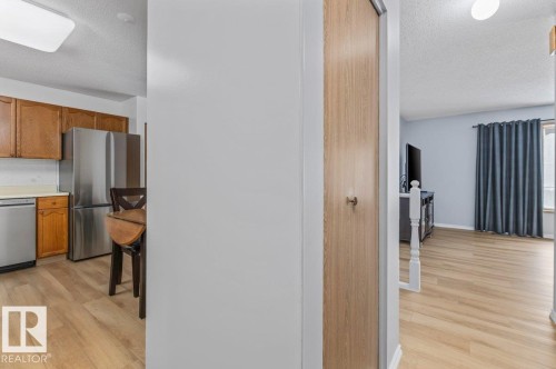 Contemporary wood-finish flooring throughout - 219 Knottwood Road N, Edmonton, AB - Indoor Photo Showing Kitchen