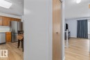 Contemporary wood-finish flooring throughout - 219 Knottwood Road N, Edmonton, AB  - Indoor Photo Showing Kitchen 