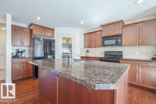 6131 12 Avenue, Edmonton, AB - Indoor Photo Showing Kitchen With Double Sink
