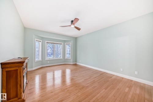 Empty room featuring light wood-style floors and a ceiling fan - 1605 Haswell Court, Edmonton, AB - Indoor Photo Showing Other Room