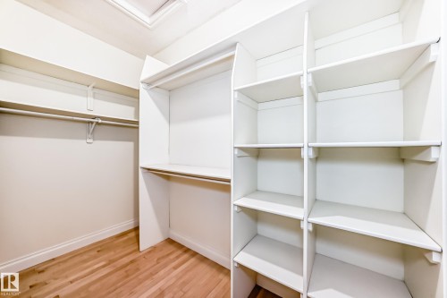 Walk in closet with light wood-type flooring - 1605 Haswell Court, Edmonton, AB - Indoor With Storage