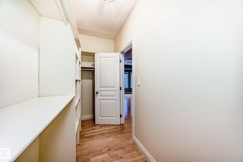 Walk in closet with light wood-type flooring - 1605 Haswell Court, Edmonton, AB - Indoor Photo Showing Other Room