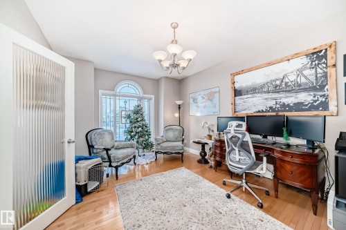 Office featuring light wood finished floors and a chandelier - 1605 Haswell Court, Edmonton, AB - Indoor Photo Showing Office