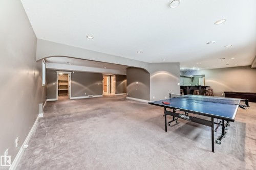 Rec room featuring arched walkways, recessed lighting, and light colored carpet - 1605 Haswell Court, Edmonton, AB - Indoor Photo Showing Other Room