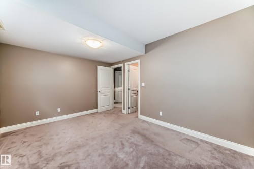 Unfurnished bedroom featuring baseboards and carpet floors - 1605 Haswell Court, Edmonton, AB - Indoor Photo Showing Other Room