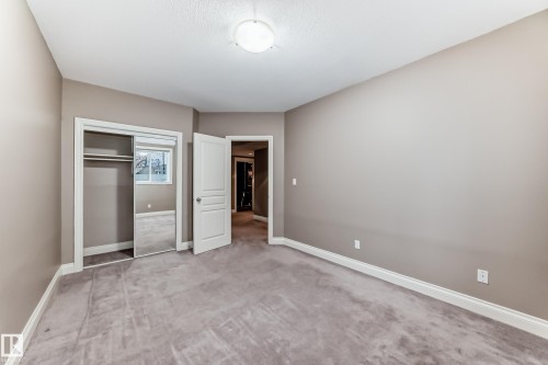 Unfurnished bedroom with a closet and carpet - 1605 Haswell Court, Edmonton, AB - Indoor Photo Showing Other Room
