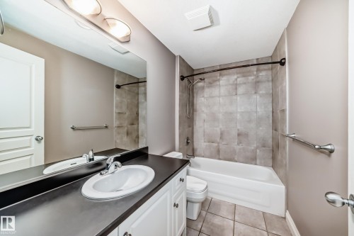 Full bath featuring shower / tub combination, vanity, and light tile patterned floors - 1605 Haswell Court, Edmonton, AB - Indoor Photo Showing Bathroom