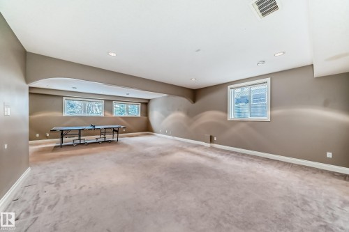Spare room with light colored carpet, recessed lighting, and arched walkways - 1605 Haswell Court, Edmonton, AB - Indoor Photo Showing Other Room