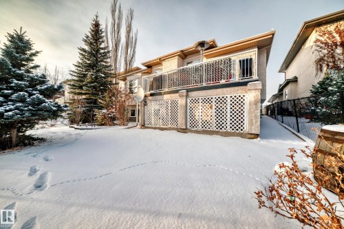 Snow covered back of property featuring stucco siding - 1605 Haswell Court, Edmonton, AB - Outdoor