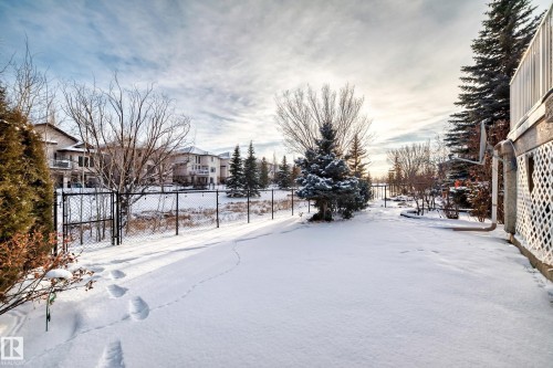 Snowy yard featuring a gate - 1605 Haswell Court, Edmonton, AB - Outdoor