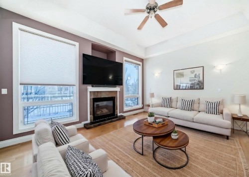 Aerial view of property's location with nearby suburban area - 1605 Haswell Court, Edmonton, AB - Indoor Photo Showing Living Room With Fireplace