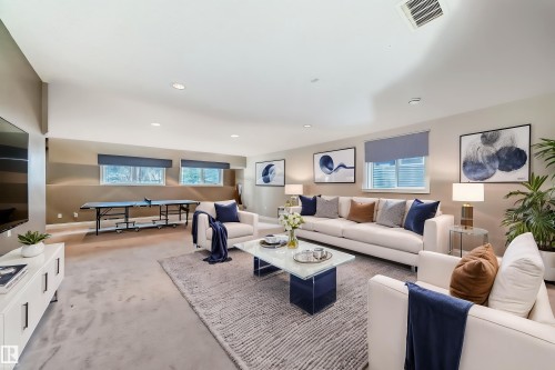 The spacious interior features recessed lighting and multiple windows, providing natural light - 1605 Haswell Court, Edmonton, AB - Indoor Photo Showing Living Room