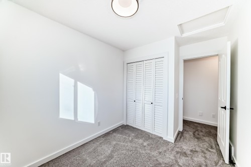 Unfurnished bedroom with carpet and a closet - 4008 37 Avenue, Edmonton, AB - Indoor Photo Showing Other Room