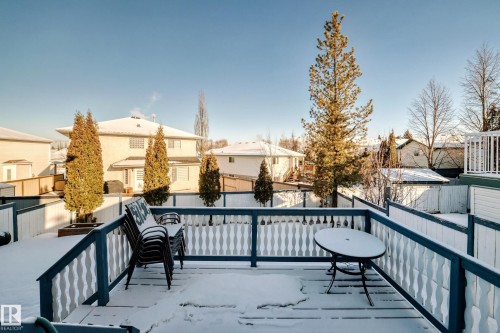 Snow covered deck featuring a residential view - 4008 37 Avenue, Edmonton, AB - Outdoor With Exterior