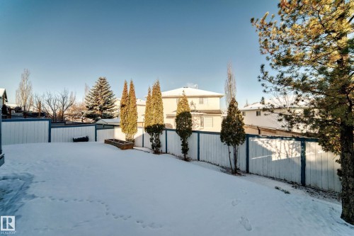 Yard covered in snow featuring a fenced backyard - 4008 37 Avenue, Edmonton, AB - Outdoor