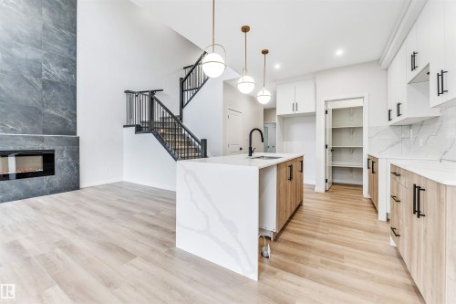 8712 181 Avenue, Edmonton, AB - Indoor Photo Showing Kitchen With Fireplace