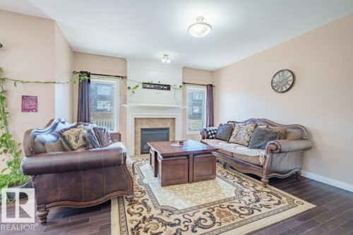 6103 18 Avenue, Edmonton, AB - Indoor Photo Showing Living Room With Fireplace